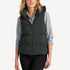 Front view variant of women’s navy and gray waterproof puffer vest on model – Louvóre apparel